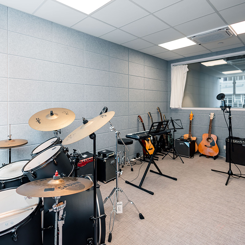 Music Studio: A fully equipped music space featuring drum kits, recording facilities and other equipment